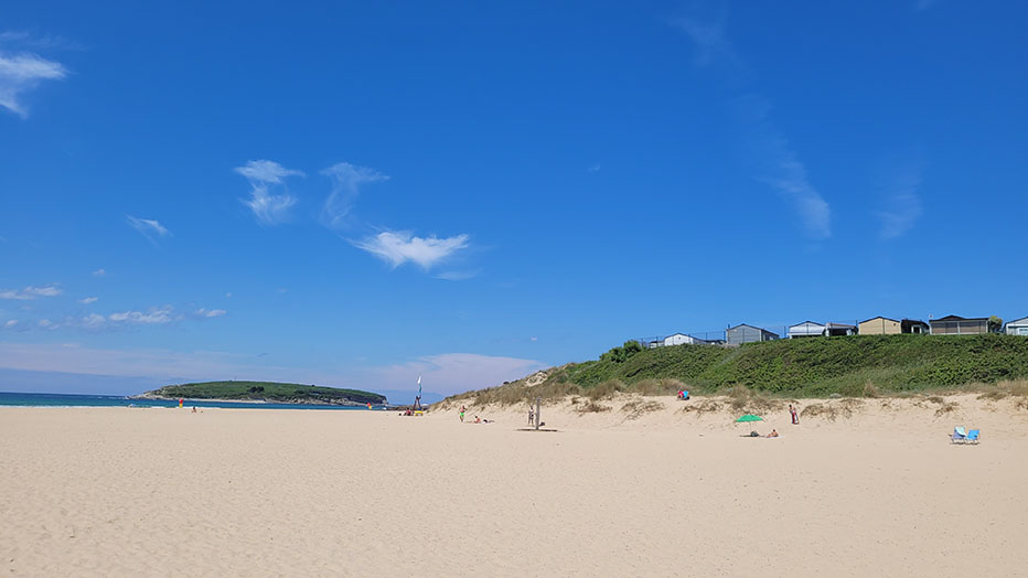 The beach at Somo is overlooked by Camping Derby Loredo